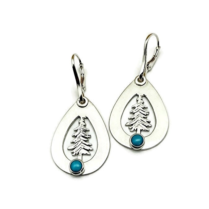 Teardrop-shaped silver earrings with tree and turquoise stone design on a white background